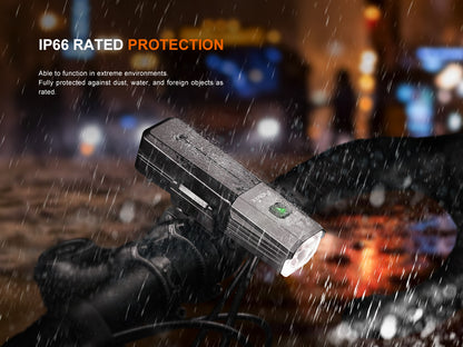 Fenix BC22R Bike Light with IP66 rating in rain, city lights blurred in background