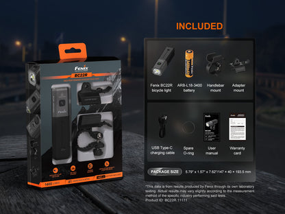 Fenix BC22R bicycle light packaging with included items list on a dark background