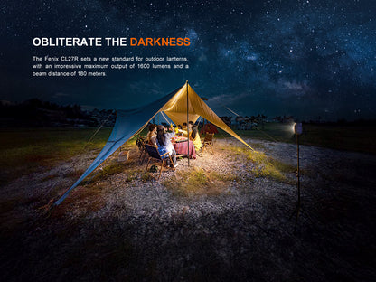 Camping scene with a tent illuminated by Fenix CL27R Lantern against a starry night sky.