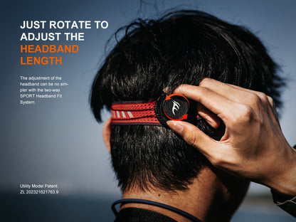Person adjusting a red and black headband of Fenix HL18R-T V2.0 headlamp with text on headband length adjustment.