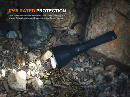 Black flashlight on a rocky ground with IP68 rating text overlay