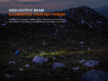 Person using a Fenix HL12R V2.0 Headlamp in a dark landscape with text about high-output beam