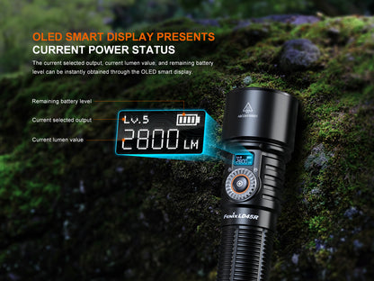 Black Fenix LD45R Flashlight with OLED display on a mossy background