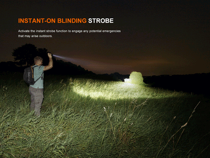 Fenix LD45R Flashlight in strobe light mode illuminating grassy area to night. 