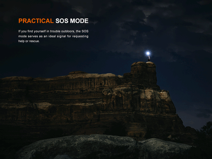 Person sending SOS signal with Fenix LD45R Flashlight from the top of rocky mountain at night. 